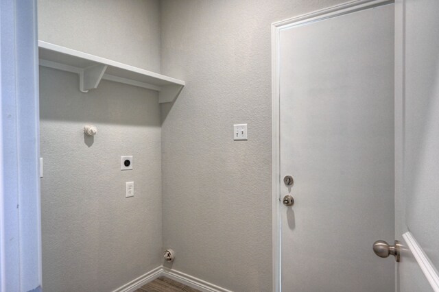 laundry room featuring hookup for an electric dryer and hardwood / wood-style flooring