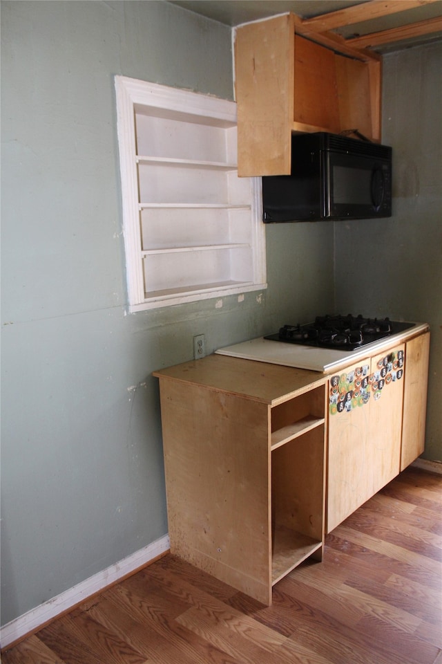 kitchen with black appliances and light wood-type flooring