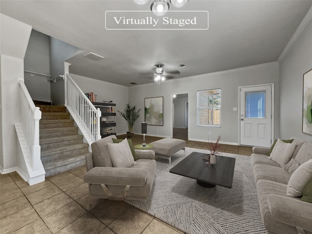 living room featuring tile patterned floors, ornamental molding, and ceiling fan