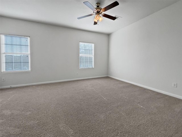 carpeted empty room featuring ceiling fan