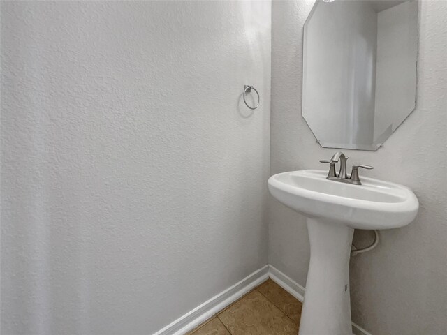 bathroom with tile patterned floors