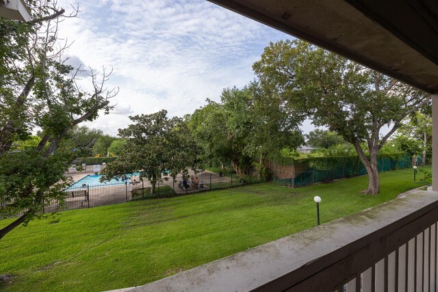 view of yard featuring a community pool