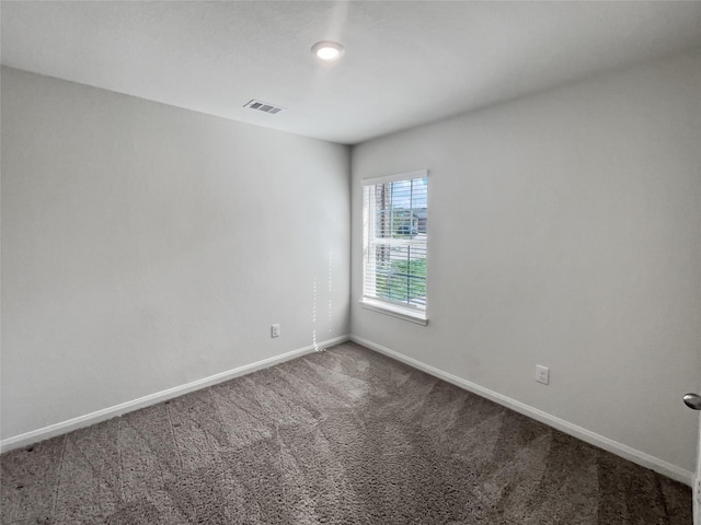 unfurnished room featuring carpet