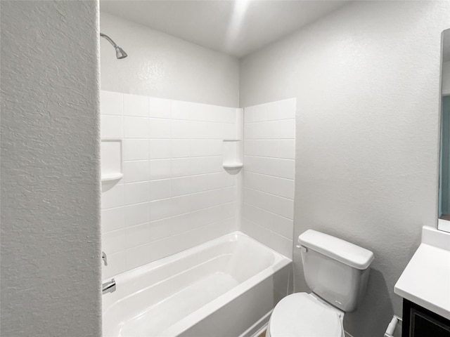 full bathroom featuring toilet, vanity, and tub / shower combination