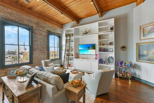 living room featuring beam ceiling, track lighting, brick wall, wooden ceiling, and dark hardwood / wood-style flooring