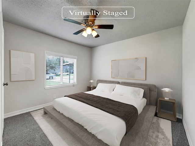 carpeted bedroom with ceiling fan and a textured ceiling