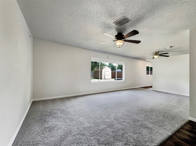 unfurnished room with carpet, a textured ceiling, and ceiling fan