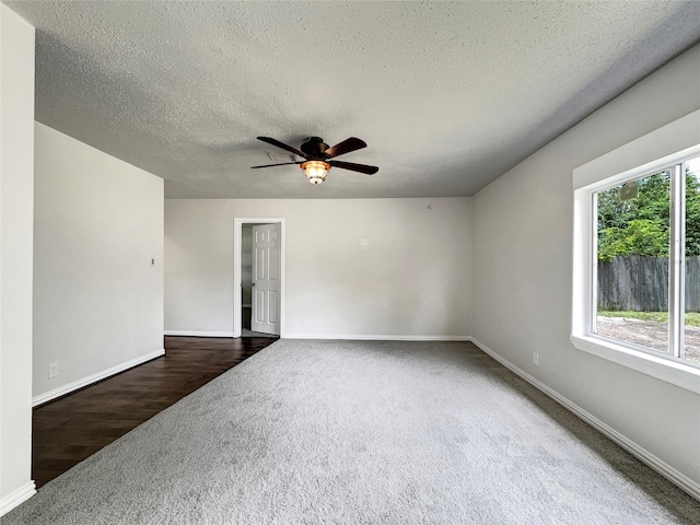 unfurnished room with carpet floors, a textured ceiling, and ceiling fan