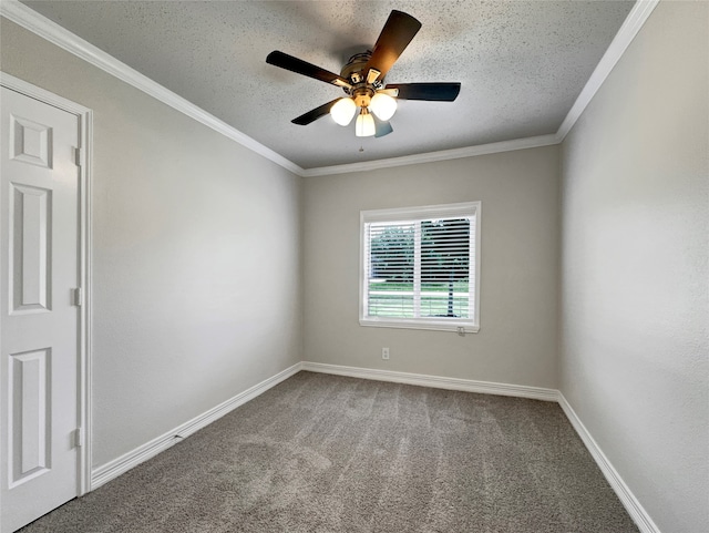 spare room featuring ornamental molding, carpet flooring, a textured ceiling, and ceiling fan