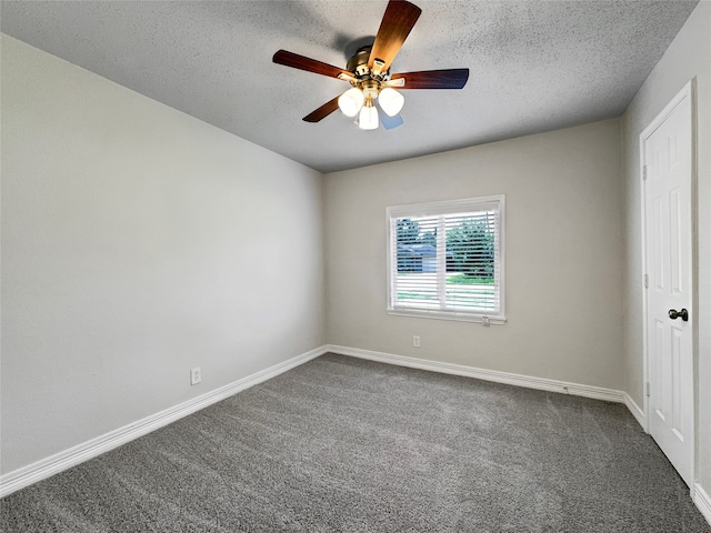 carpeted spare room with a textured ceiling and ceiling fan