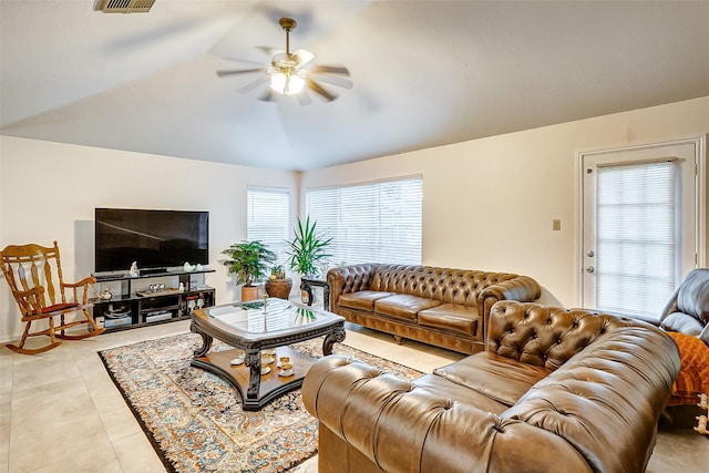 tiled living room with vaulted ceiling and ceiling fan