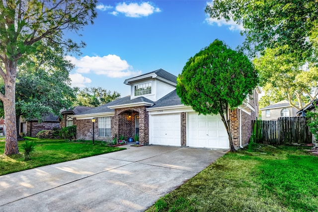 view of front of home featuring a garage and a front lawn