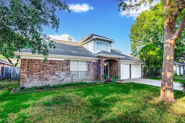 view of front of property featuring a garage and a front yard