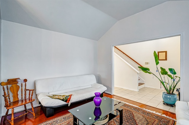 sitting room featuring vaulted ceiling and light hardwood / wood-style floors