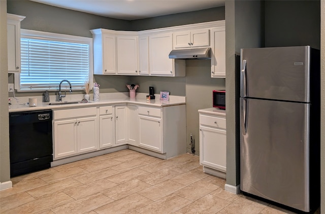 kitchen with black appliances, sink, and white cabinetry