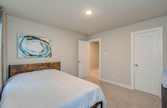 5727 Daylight Cv, Fulshear, TX 77441 - bedroom featuring light carpet and baseboards