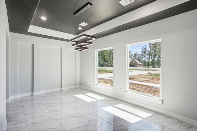 spare room featuring a textured ceiling