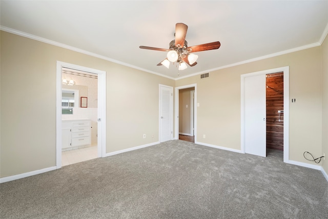 unfurnished bedroom with ensuite bathroom, carpet, ceiling fan, and crown molding