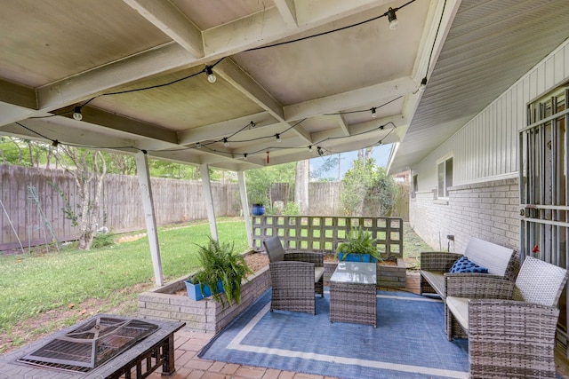 view of patio / terrace featuring an outdoor fire pit