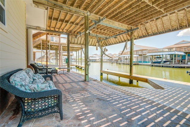 dock area with outdoor lounge area and a water view