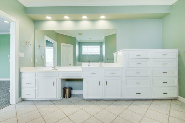 bathroom with crown molding, tile patterned flooring, and vanity