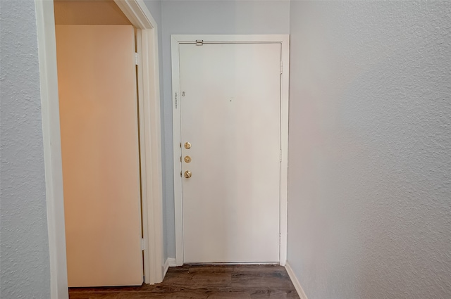 corridor featuring hardwood / wood-style floors