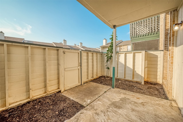 view of patio / terrace with a shed