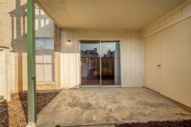 doorway to property with a patio