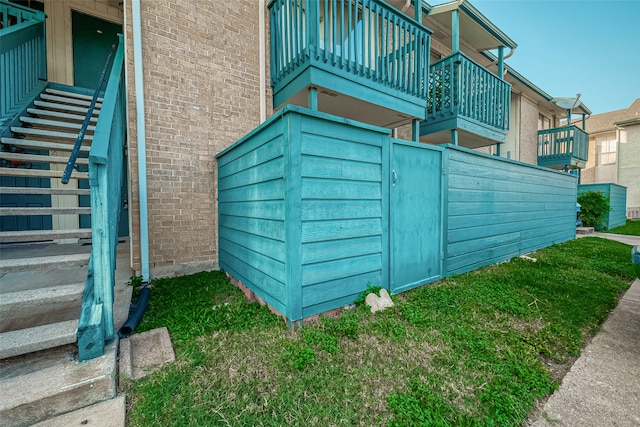 view of home's exterior with a lawn