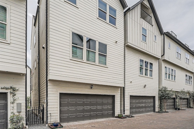 view of side of home featuring a garage