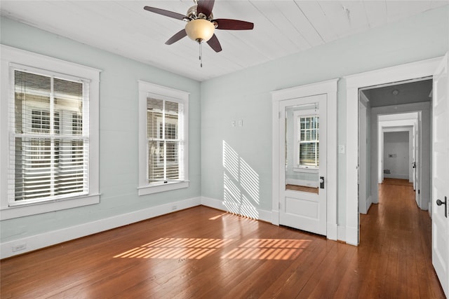 spare room featuring ceiling fan and dark hardwood / wood-style floors