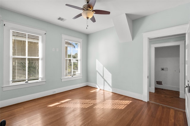 empty room featuring wood-type flooring and ceiling fan