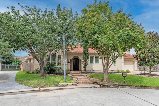 view of front of property with a garage