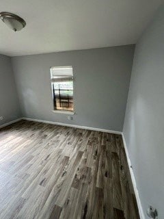 spare room with hardwood / wood-style flooring