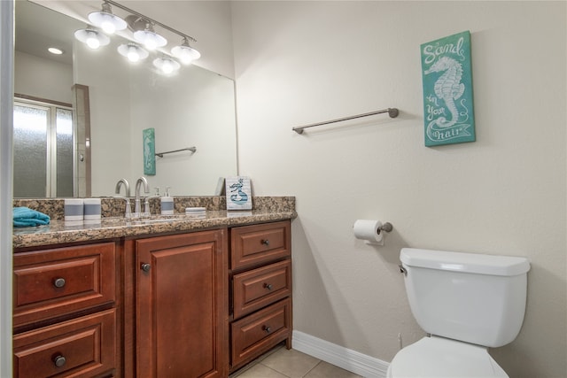 bathroom with tile patterned floors, toilet, and vanity