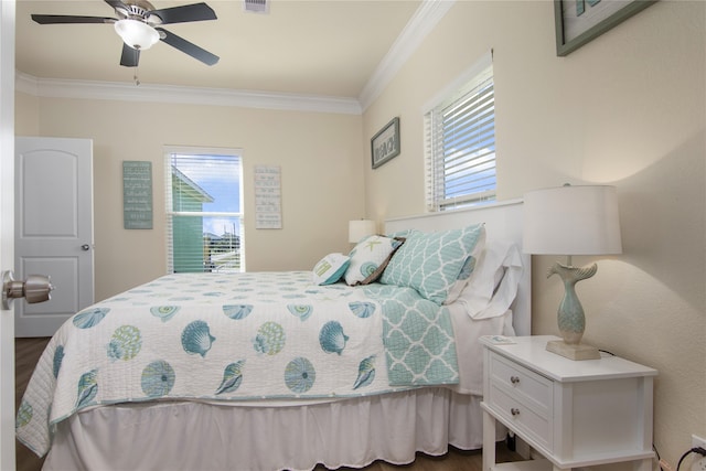 bedroom with ceiling fan, wood-type flooring, and ornamental molding