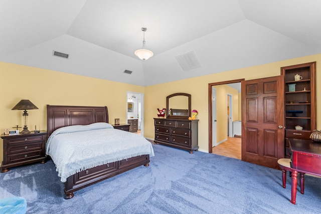 bedroom with lofted ceiling and light colored carpet