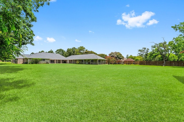 view of yard with fence