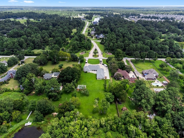 drone / aerial view featuring a view of trees