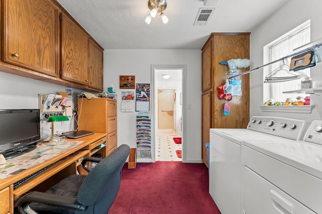 clothes washing area featuring cabinet space, visible vents, washing machine and clothes dryer, dark colored carpet, and a textured ceiling