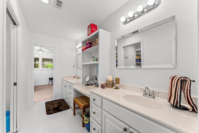 bathroom featuring ceiling fan, vanity, and tile patterned flooring