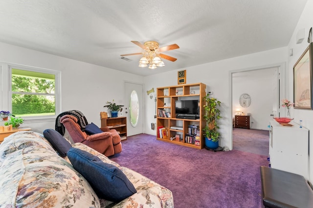 carpeted living area with a ceiling fan and visible vents