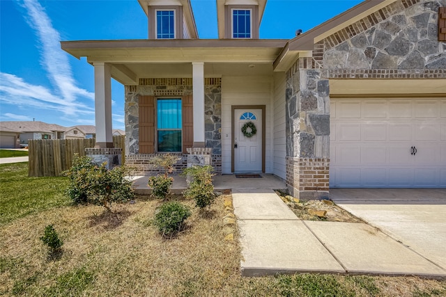 view of exterior entry with a lawn