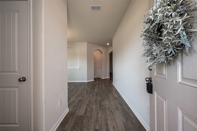 hallway with wood-type flooring