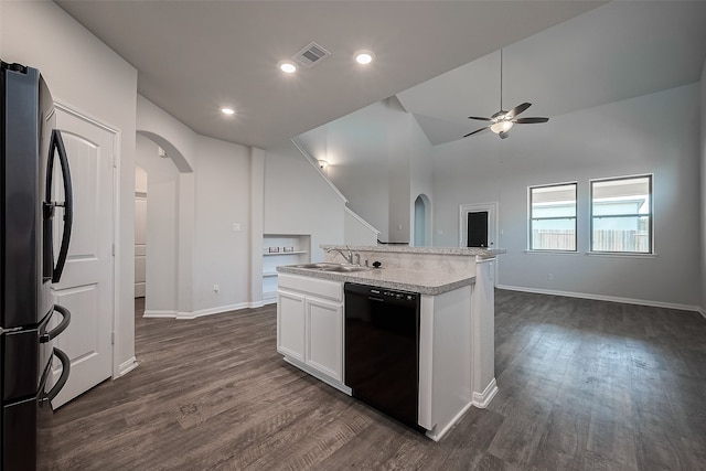 kitchen with white cabinets, dark hardwood / wood-style flooring, ceiling fan, black appliances, and vaulted ceiling