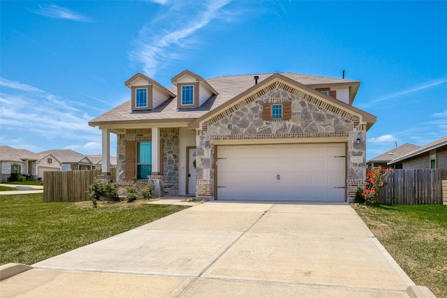 view of front of house featuring a garage and a front yard