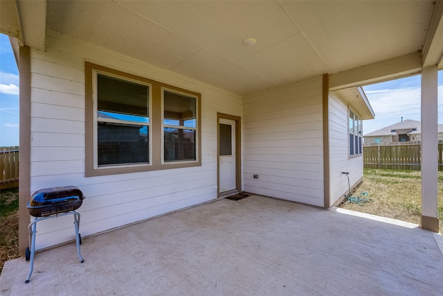 view of patio featuring a grill