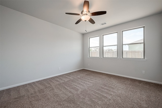 carpeted empty room with ceiling fan