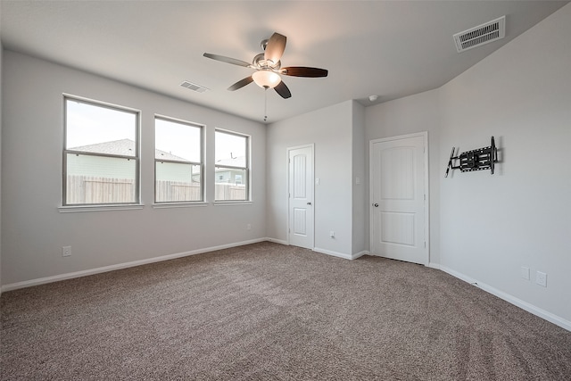 unfurnished bedroom featuring carpet floors and ceiling fan