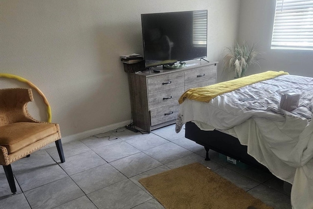 bedroom with light tile patterned floors